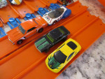 Hot Wheels two lane track, ten extra track and 25 cars