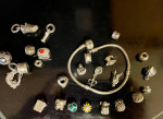 Authentic Pandora sterling silver 7.5 inch bracelet with 24 charms