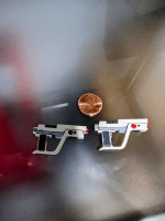 Pair of futuristic laser pistol side arms for action figures