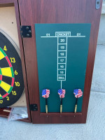 Dartboard and cabinet