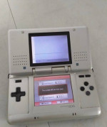DS NINTENDO SILVER COLOR  PLUS 4 GAMES AND ACCESSORIES $95