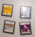 DS NINTENDO SILVER COLOR  PLUS 4 GAMES AND ACCESSORIES $95
