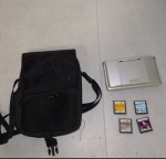 DS NINTENDO SILVER COLOR  PLUS 4 GAMES AND ACCESSORIES $95