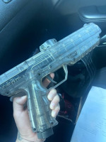 Two paintball guns with accesories