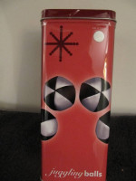 Juggling Balls in Tin Container