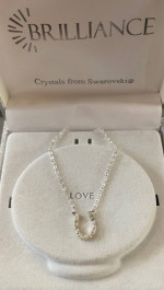 Horseshoe shaped pendant, necklace with diamonds
