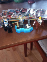 7 Lego Ninjago Books, like new, and some figurines