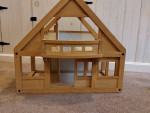 Plan Toys wooden dollhouse with furniture and people