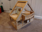 Plan Toys wooden dollhouse with furniture and people