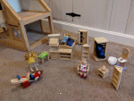 Plan Toys wooden dollhouse with furniture and people