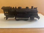 Lionel O-gauge switcher locomotive and coal car