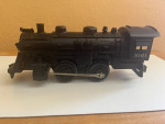 Lionel O-gauge switcher locomotive and coal car