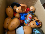 lot of potatos head with accesories