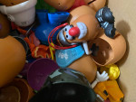 lot of potatos head with accesories