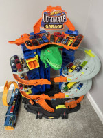 Hot Wheels Toy Car Track Set Ultimate Garage Moving T-Rex Dinosaur