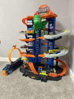 Hot Wheels Toy Car Track Set Ultimate Garage Moving T-Rex Dinosaur