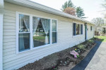 brand new Stainless Steel Appliances(2025), bar height breakfast bar, dining area, laundry storage room