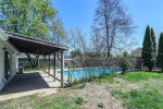 brand new Stainless Steel Appliances(2025), bar height breakfast bar, dining area, laundry storage room