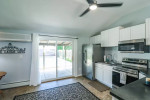 brand new Stainless Steel Appliances(2025), bar height breakfast bar, dining area, laundry storage room
