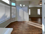 Walk into the spacious living room with natural light from multiple windows
