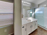 Walk into the spacious living room with natural light from multiple windows