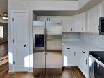 Walk into the spacious living room with natural light from multiple windows