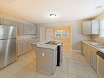 This updated 4 bedroom, 2 bath home is nestled on a level lot in a quiet neighborhood near MLK Jr.