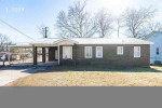 Full brick house has 2-car caport and a large backyard. Inside, you'll find 3 bedrooms, 1 Bathroom