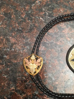 beautiful gold western buckle and bolo