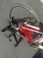 Bicycle trainer with adjustable remote