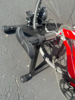 Bicycle trainer with adjustable remote