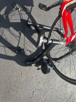 Bicycle trainer with adjustable remote