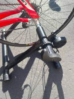 Bicycle trainer with adjustable remote