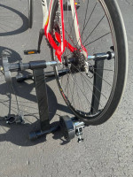 Bicycle trainer with adjustable remote