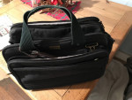 Attache case  made of canvas. Heavey duty  lotsa of pockets  will hold a laptop 