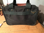 Attache case  made of canvas. Heavey duty  lotsa of pockets  will hold a laptop 
