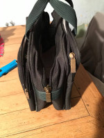 Attache case  made of canvas. Heavey duty  lotsa of pockets  will hold a laptop 