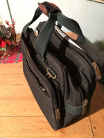 Attache case  made of canvas. Heavey duty  lotsa of pockets  will hold a laptop 