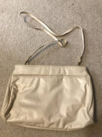 Cream colored purse with shoulder strap