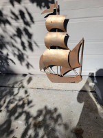 Steel sailboat decoration. 50" tall, by 28" wide.