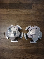 two Chevy center caps