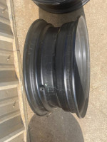 FOUR 14"X5.5" FACTORY 14 HOLE STOCK BLACK STEEL WHEELS--OS