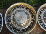 lot of 3 - 1975 to 1985 Cadillac Wire Spoke Wheel Covers Hubcaps