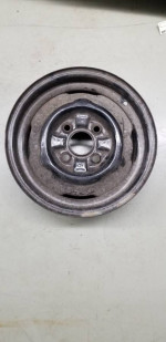 one 14" X 4.5" four lug 4.5" bolt circle FoMoCo steel wheel 5MC date