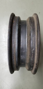 one 14" X 4.5" four lug 4.5" bolt circle FoMoCo steel wheel 5MC date