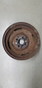 one 14" X 4.5" four lug 4.5" bolt circle FoMoCo steel wheel 5MC date