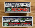 NEW IN BOXES... 2 Hess Trucks
