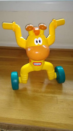 Little Tikes riding Giraffe