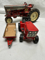 2 Tractors, 2 Cars, And A Trailer