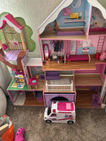 Large Barbie dollhouse mansion with accessories and ambulance